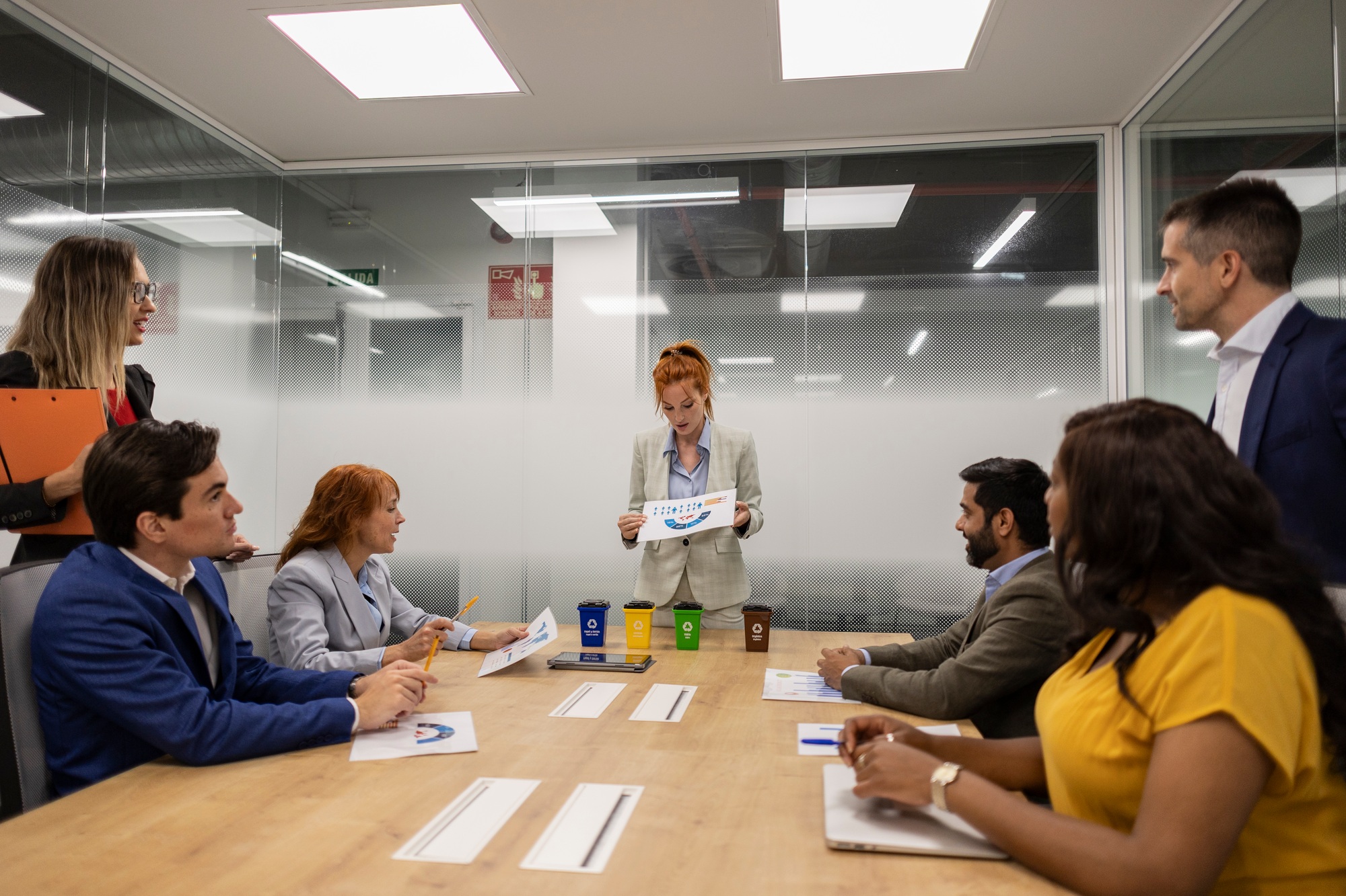 Multiethnic business team discussing corporate social responsibility during meeting